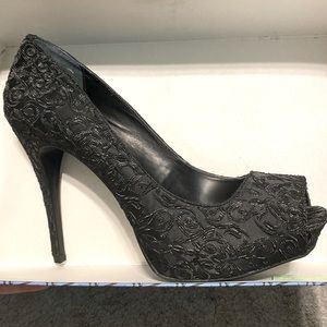 Never worn, stunning black lace design Vera Wang heels